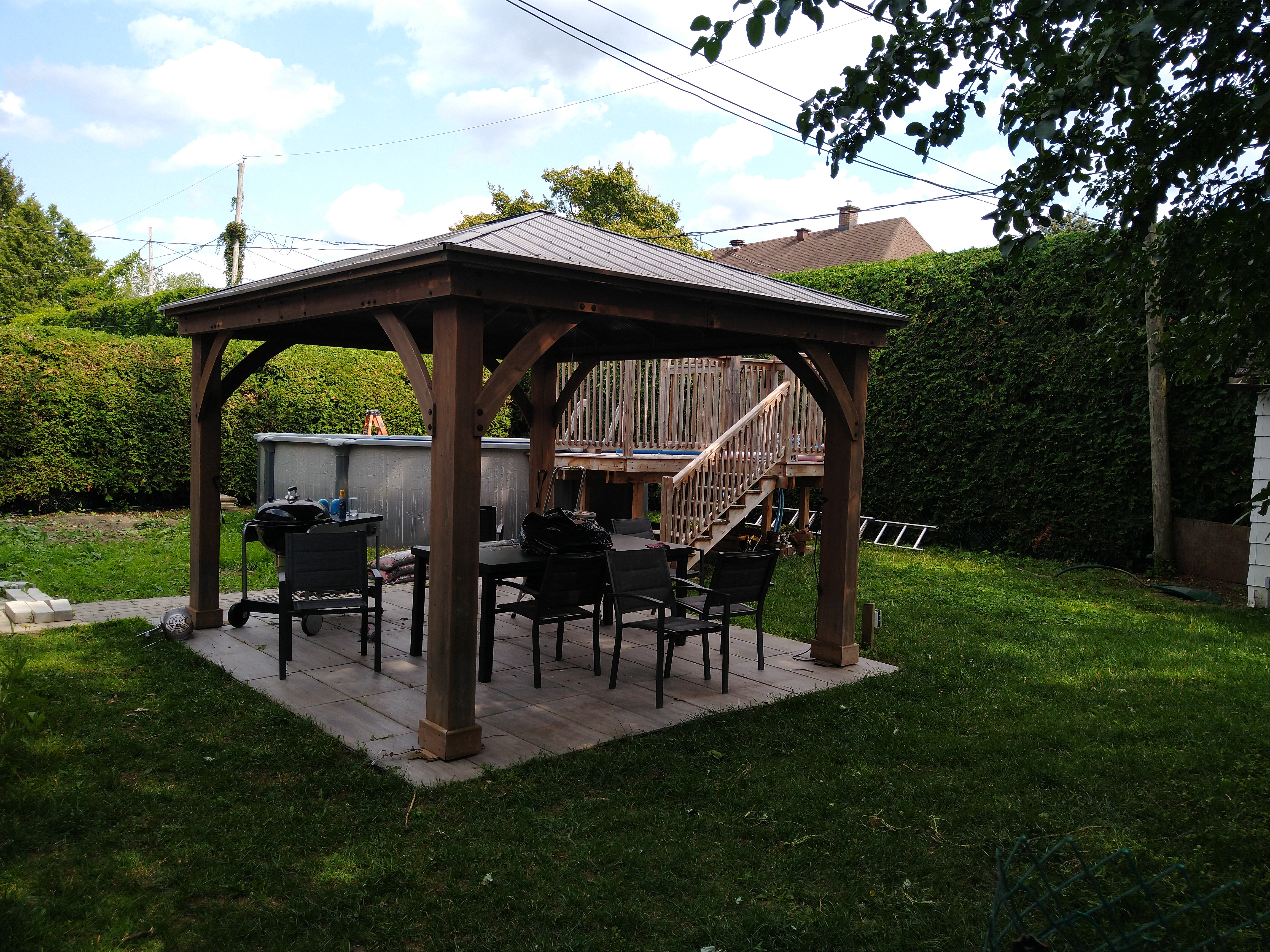 Figure 1: Picture of my backyard, with a gazebo sitting on a pavers patio